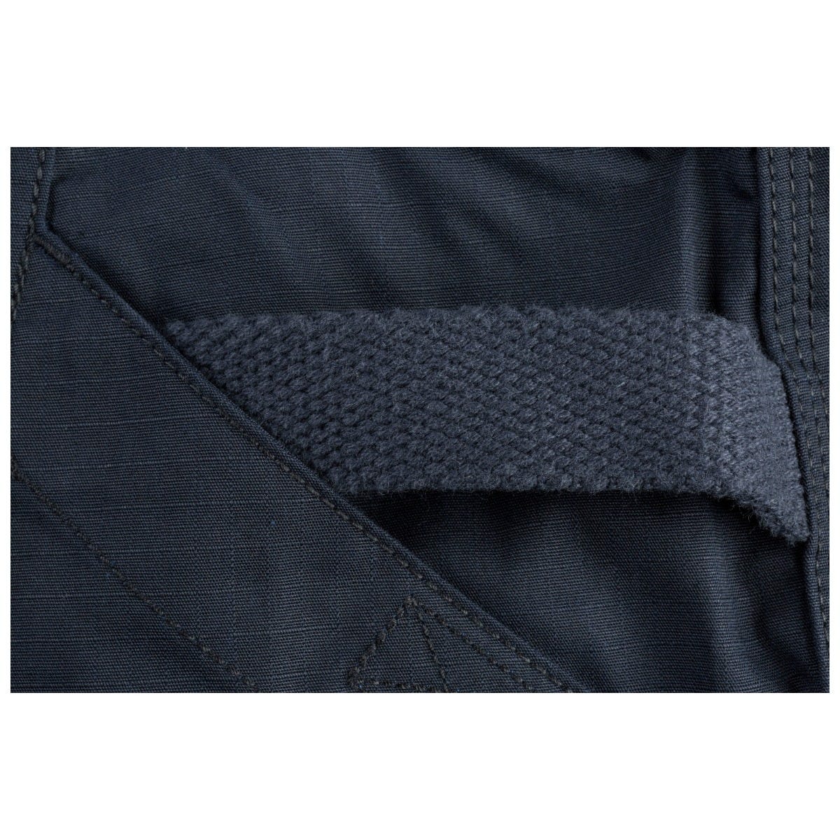 Close-up of a dark blue fabric with a textured band